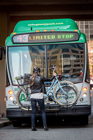 Photo: bicycle being loaded onto bike rack on ART bus