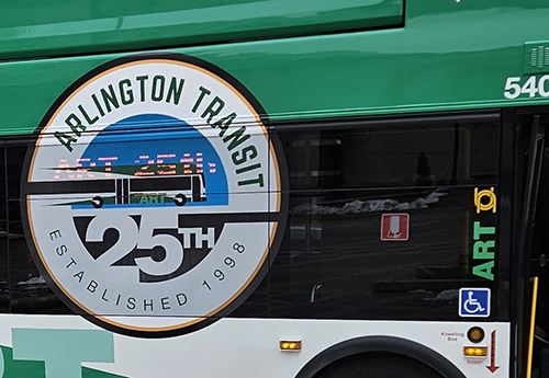 Image of the side of an ART bus with the ART 25th Anniversary logo